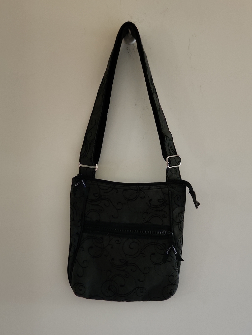 Black Women's Crossbody Bag with Subtle Swirl Pattern From Thirty One.
